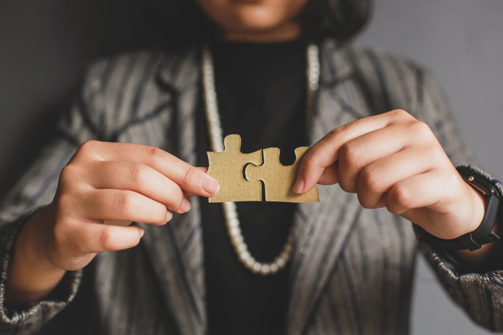 Hand Connecting Puzzle Piece